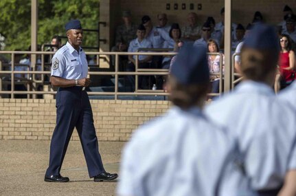 Chief Master Sgt. of the Air Force Kaleth O. Wright addresses Airmen during a basic military training graduation Aug. 30, 2018