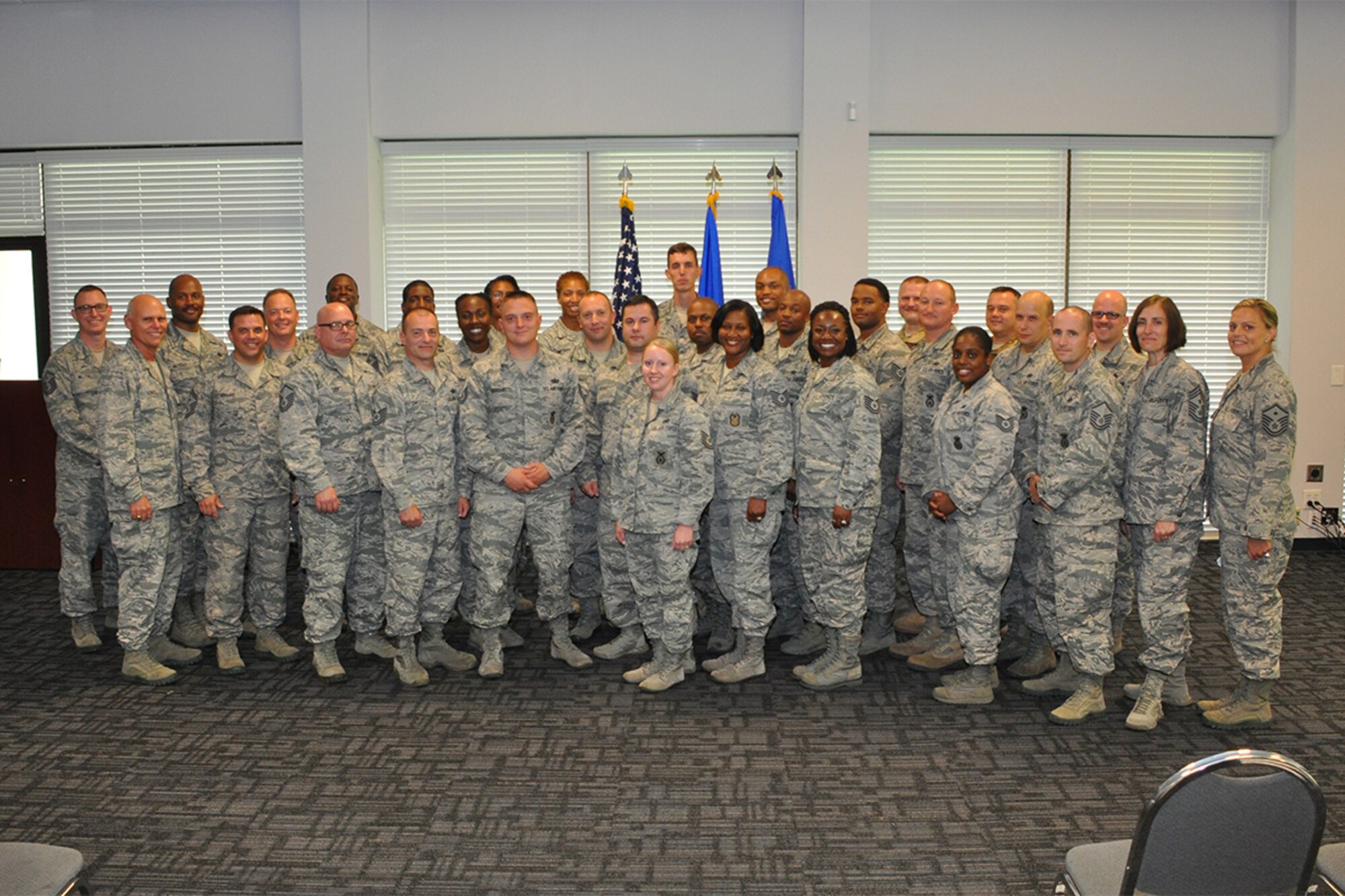 Attendees from the Additional Duty First Sergeant Symposium, pose for a group photo at Dobbins Air Reserve Base, Georgia, Aug. 5, 2018. More than 20 Master and Technical Sergeants from the 94th Airlift Wing attended the event to learn about the duties and responsibilities of being a first sergeant, or an additional duty first sergeant. (U.S. Air Force photo/Master Sgt. James Branch)