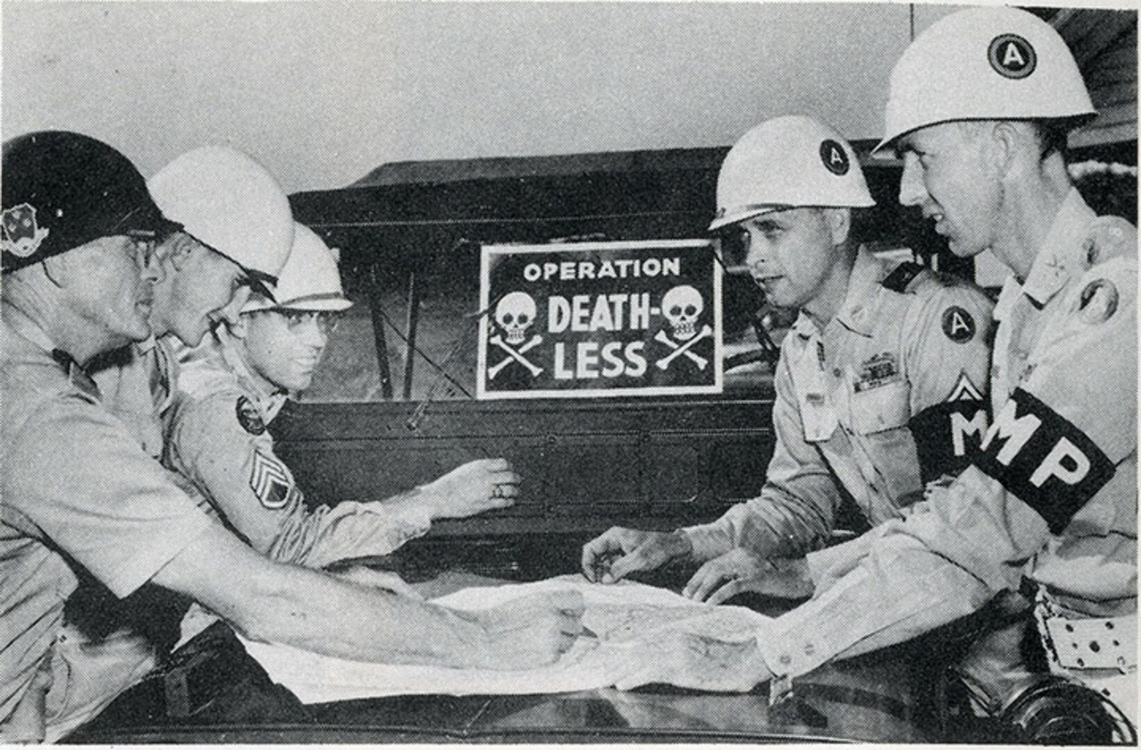 Georgia Army National Guard Lt. Col. John P. Wallis identifies a roadblock position on a map for Georgia Guard Soldiers of the Elberton-based 950th Antiaircraft Artillery Battalion.