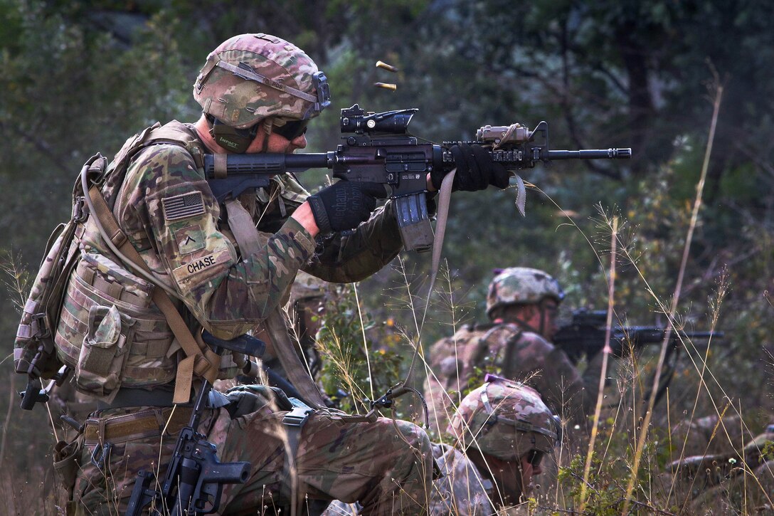 A soldier fire’s an M4 carbine during a live-fire exercise.