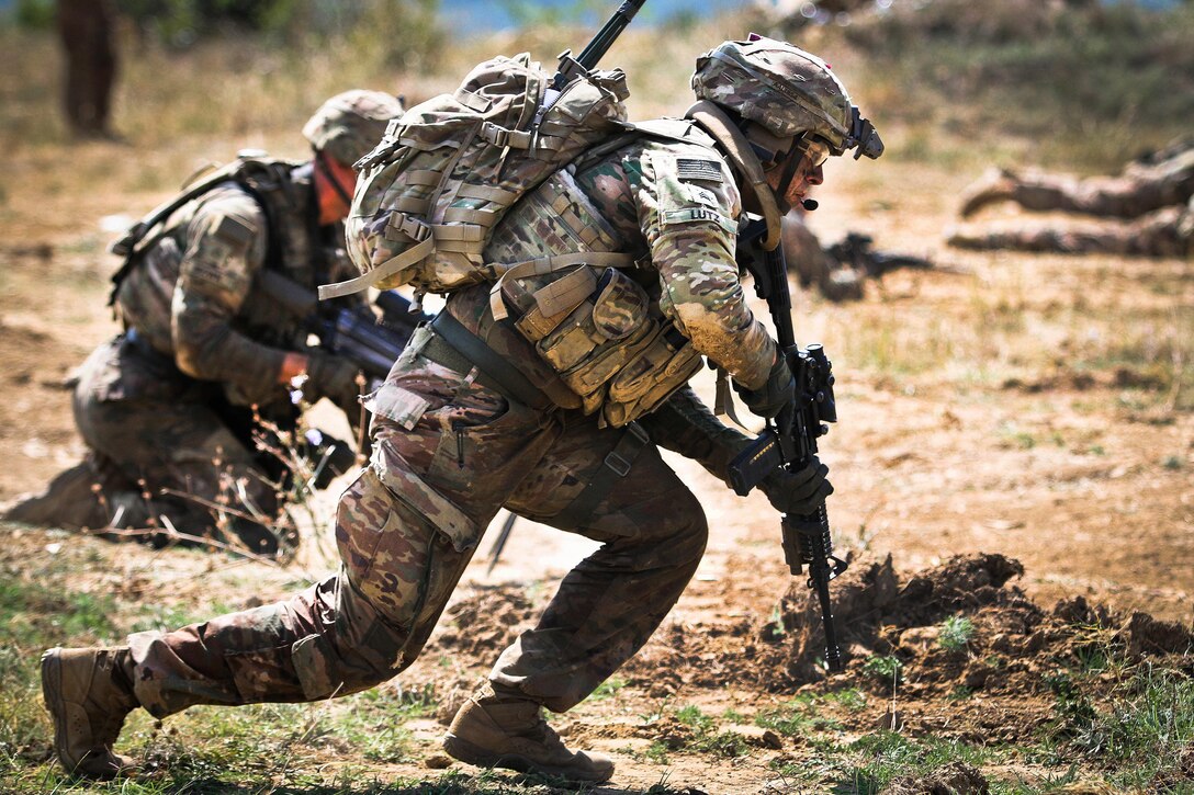 A soldier rushes to his next fighting position during a live-fire exercise.