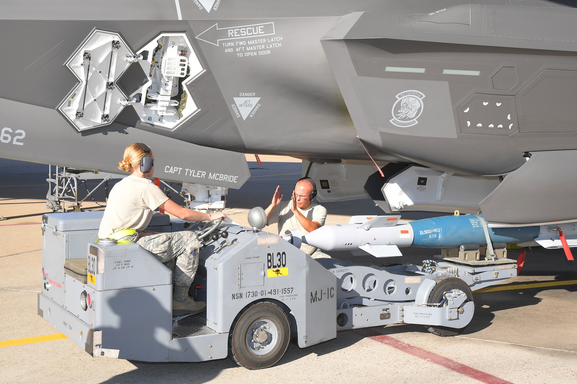 (Left to right) Airman 1st Class Kayla Lewis and Staff Sgt. Adam Selmon, 388th Aircraft Maintenance Squadron, load target munitions on an F-35A Lightning II Aug. 8, 2018, at Hill Air Force Base, Utah. Airmen and F-35s from the active-duty 388th Fighter Wing and Reserve 419th Fighter Wing at Hill AFB participated in the Air Force’s Weapon System Evaluation Program known as Combat Hammer. (U.S. Air Force photo by Todd Cromar)