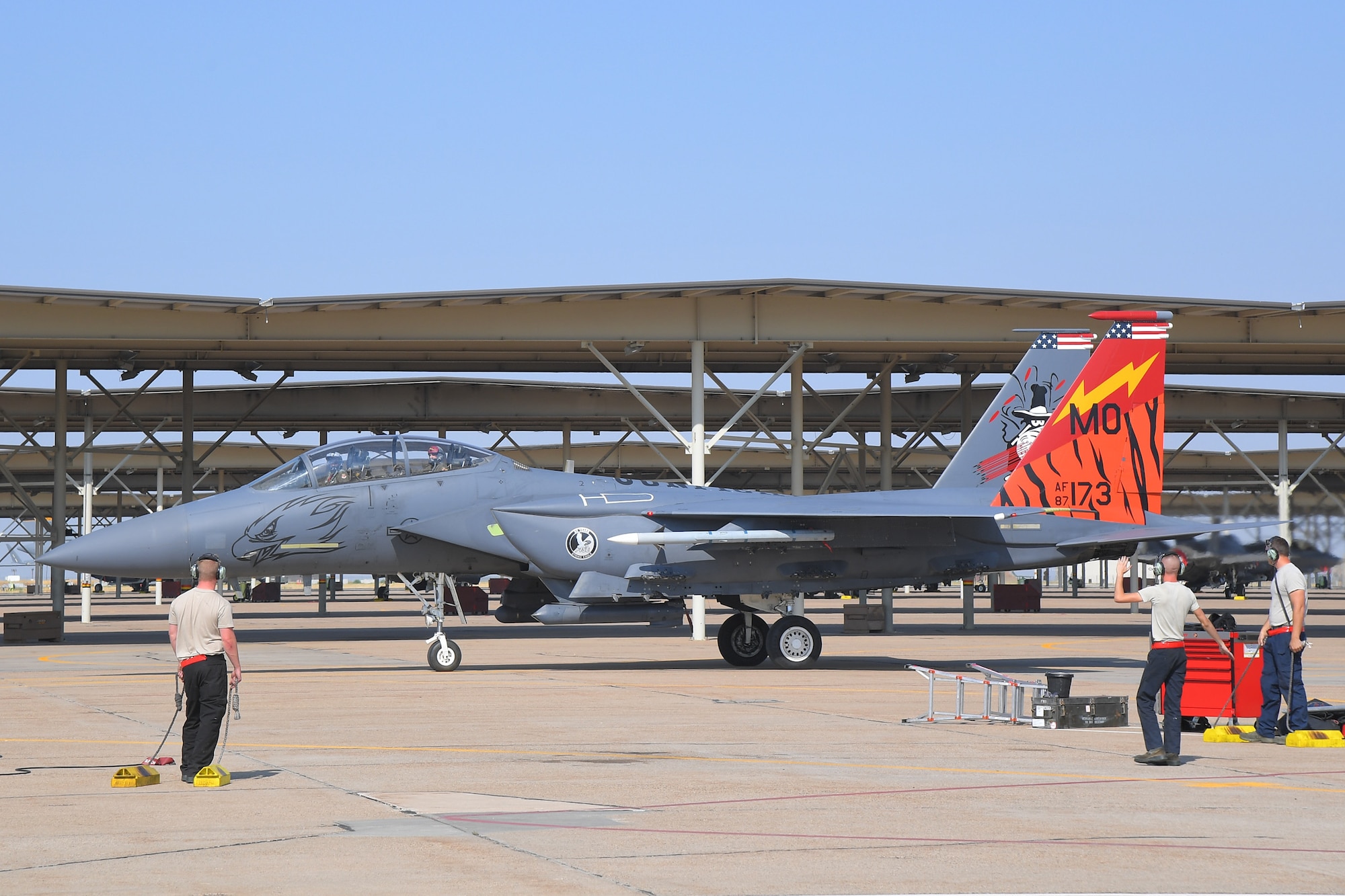 (Left to right) Senior Airman Timothy Sherman, Airman 1st Class Corey Conner and Staff Sgt. Brandon Bennett, 389th Fighter Squadron, recover an F-15E Strike Eagle Aug. 15, 2018, at Hill Air Force Base, Utah. The 389th FS at Mountain Home Air Force Base, Idaho, were at Hill AFB to participate in the Air Force’s Weapons System Evaluation Program known as Combat Hammer. (U.S. Air Force photo by Todd Cromar)