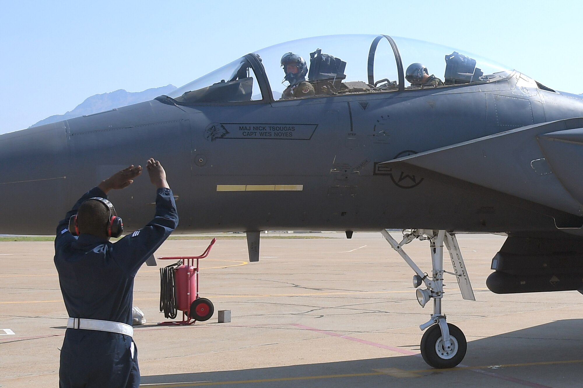 Senior Airman Deandre Moment, 389th Fighter Squadron, directs an F-15E Strike Eagle returning from a training mission Aug. 15, 2018, at Hill Air Force Base, Utah. The 389th FS at Mountain Home Air Force Base, Idaho, were at Hill AFB to participate in the Air Force’s Weapons System Evaluation Program known as Combat Hammer. (U.S. Air Force photo by Todd Cromar)   (U.S. Air Force photo by Todd Cromar)
