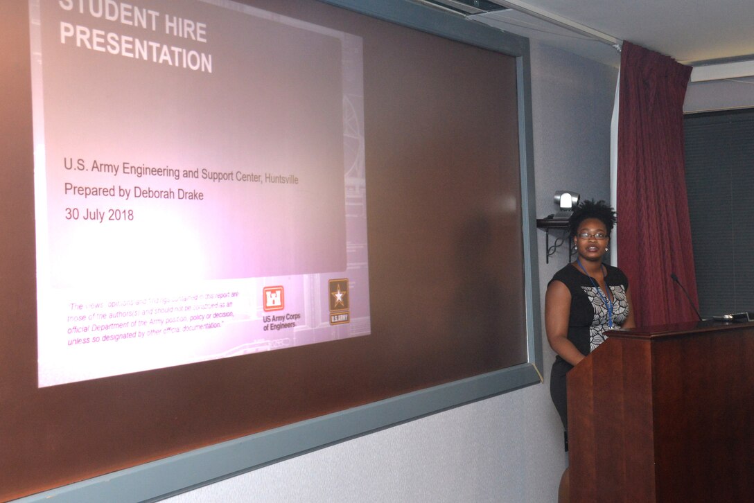 Deborah Drake, a student intern with the Communication Systems Support Branch at Huntsville Center, makes a presentation to members of the command and staff of the U.S. Army Engineering and Support Center, Huntsville, July 30. Christian and 10 other students have been working through the summer at Huntsville Center in various departments to build their real-world skills before completing their college degrees.