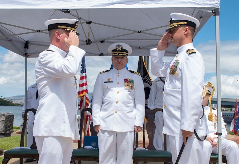 PEARL HARBOR (Aug. 31, 2018) - Cmdr. Brian Turney, left, is relieved of command by Cmdr. Chance Litton, during the Los Angeles-class fast-attack submarine USS Chicago (SSN 721) change of command ceremony at the USS Bowfin Submarine Museum and Park in Pearl Harbor, Hawaii, Aug. 31. Cmdr. Steven Dawley relieved Moller as commanding officer of Chicago. (U.S. Navy photo by Mass Communication Specialist 2nd Class Shaun Griffin/Released)