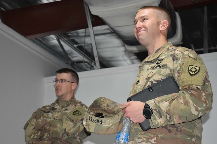 U.S. Army Capt. William Parker and U.S. Army Staff Sgt. Bryan Parker, activated members of the Kentucky Army National Guard 613th Engineering Facilities Detachment, serve as contract officer representatives for Area Support Group-Kuwait Directorate of Public Works at Camp Arifjan, Kuwait, August 6, 2018.