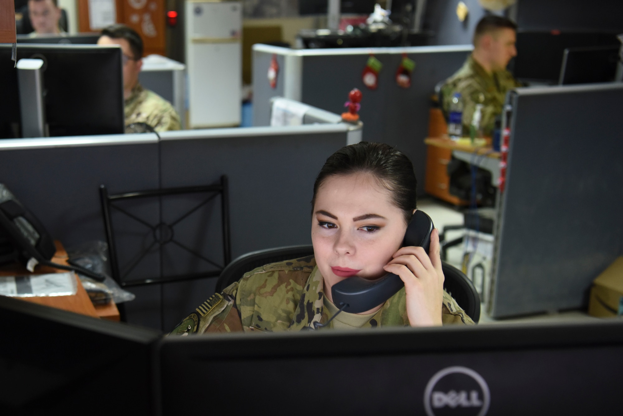 Senior Airman Christi Combs, 380th Expeditionary Communications Squadron communications focal point technician, answers a call about a ticket in the communications focal point, Nov. 28, 2018 at Al Dhafra Air Base, United Arab Emirates.