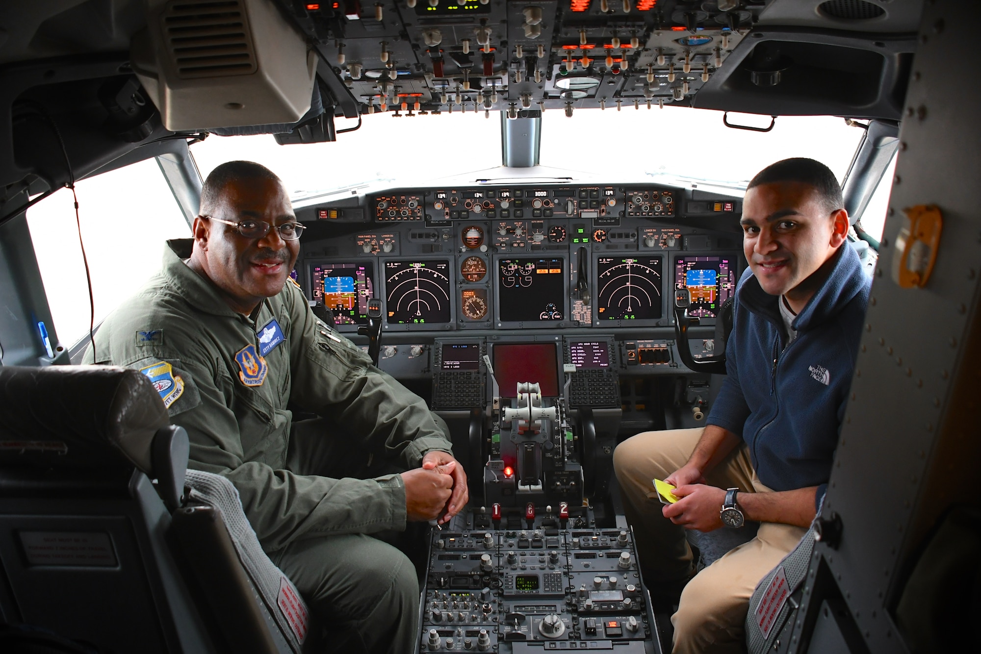 Colonel Esteban “Esty” Ramirez, the outgoing vice commander of the 932d Airlift Wing, sits in the cockpit with his son Nic Esteban, following his last C-40 flight at the 932nd Airlift Wing, Nov. 4, 2018, at Scott Air Force Base, Ill. He will be transferring to the U.S Transportation Command shortly.  During his time with the Illinois unit, Col. Esteban served at various times in roles as both the wing commander and the vice commander.  The wing flies the C-40C aircraft and is the premier distinguished visitor airlift operation in the Air Force Reserve Command. With over 1,000 members, the wing equips trains and organizes a ready force of Citizen Airmen to support and maintain all facets of air base operations involving infrastructure and security. (U.S. Air Force photo by Lt. Col. Stan Paregien)