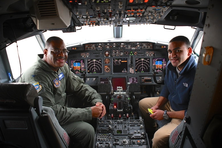 Colonel Esteban “Esty” Ramirez, the outgoing vice commander of the 932d Airlift Wing, sits in the cockpit with his son Nic Esteban, following his last C-40 flight at the 932nd Airlift Wing, Nov. 4, 2018, at Scott Air Force Base, Ill. He will be transferring to the U.S Transportation Command shortly.  During his time with the Illinois unit, Col. Esteban served at various times in roles as both the wing commander and the vice commander.  The wing flies the C-40C aircraft and is the premier distinguished visitor airlift operation in the Air Force Reserve Command. With over 1,000 members, the wing equips trains and organizes a ready force of Citizen Airmen to support and maintain all facets of air base operations involving infrastructure and security. (U.S. Air Force photo by Lt. Col. Stan Paregien)