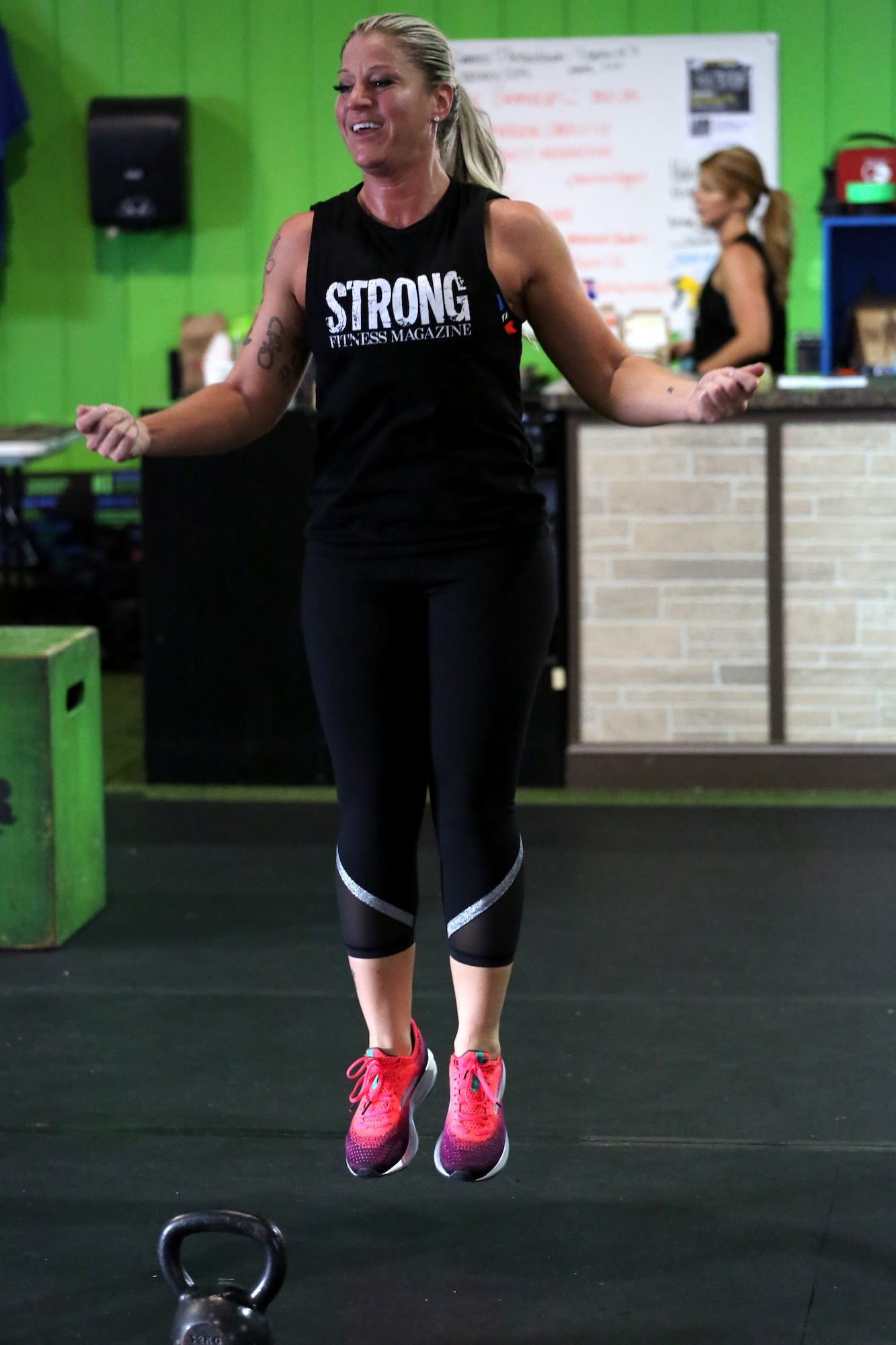 Technical Sgt. Dacia Lucas, 104th Maintenance Group aircraft engine mechanic, leads a Strong Camp workout Nov. 10, 2018, in Suffield, Connecticut. The camp empowered women through the promotion of resilience. (U.S. Air National Guard Photo by Airman 1st Class Randall S. Burlingame)
