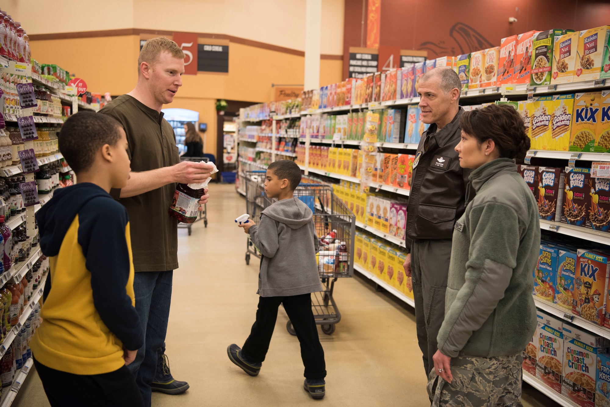Air Force Lt. Gen. Tom Bussiere, Commander of Alaskan North American Aerospace Defense Command, Alaskan Command, and the Eleventh Air Force, and 673d Air Base Wing Commander Col. Patricia A. Csànk, speak with volunteers at the Joint Base Elmendorf-Richardson, Alaska, Commissary Dec. 1, 2018. In less than 48 hours after the 7.0 magnitude Earthquake striking the Anchorage area at 8:29 a.m. the morning of Nov.30, 2018, JBER is mission ready and capable of resuming regular operations.