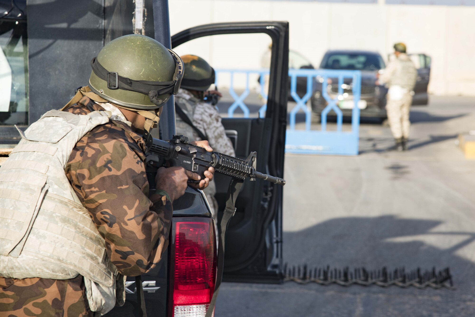Royal Jordanian Air Force force protection professionals provide overwatch during a simulated entry control stop at a base outside of Amman, Jordan Nov. 27.  The simulation was part of a joint partnership training exercise with U.S. Forces visiting there.  (U.S. Air Force photo by Staff Sgt. Stephen Eigel)