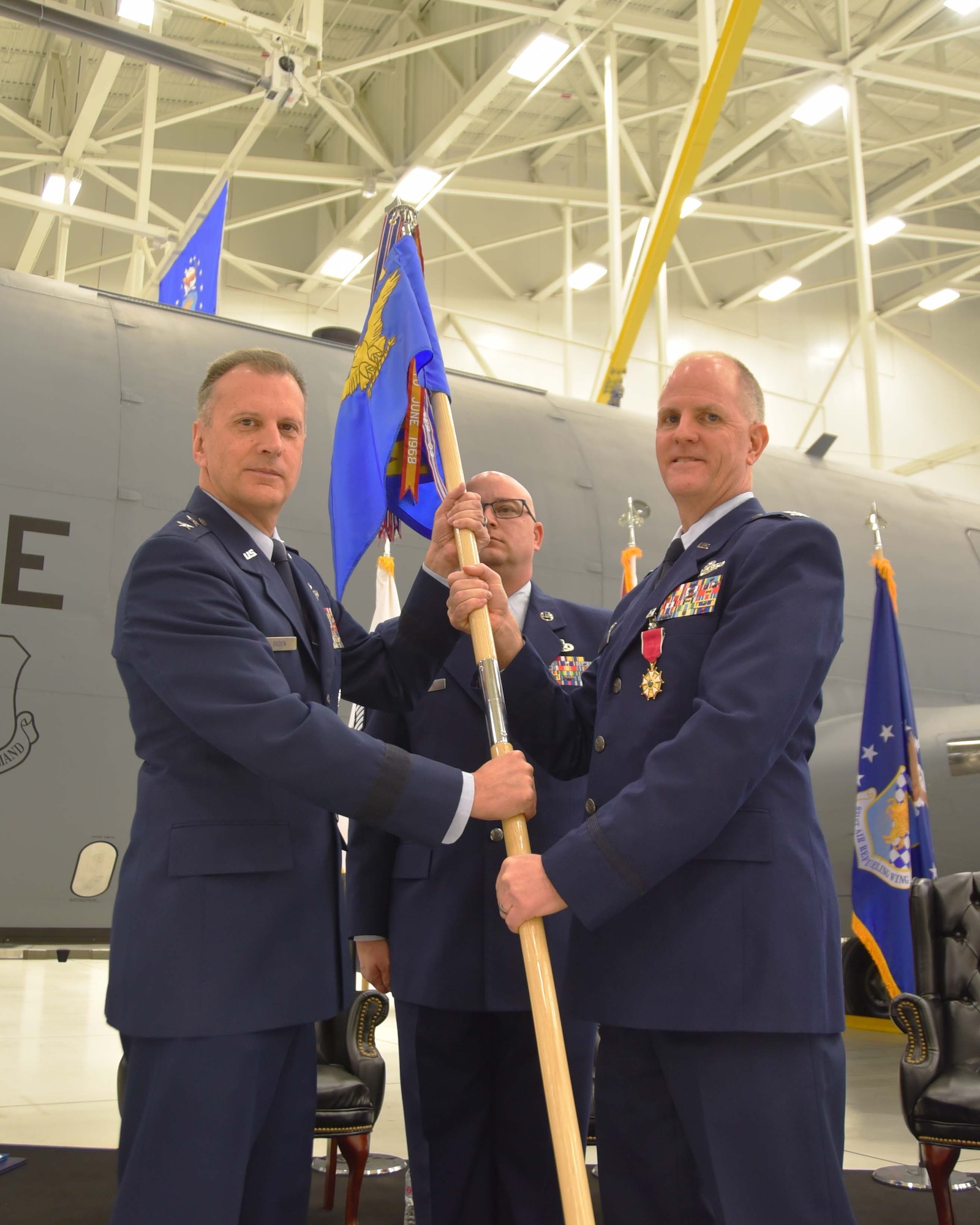 Maj. Gen. Randall A. Ogden, 4th Air Force commander, takes the guidon from Col. Eric Vitosh, outgoing 931st Air Refueling Wing commander, during a change of command ceremony Dec. 1, 2018, McConnell Air Force Base, Kan.  Vitosh, a Traditional Reservist, has commanded the 931st for more than a year.  (U.S. Air Force photo by Tech. Sgt. Abigail Klein)
