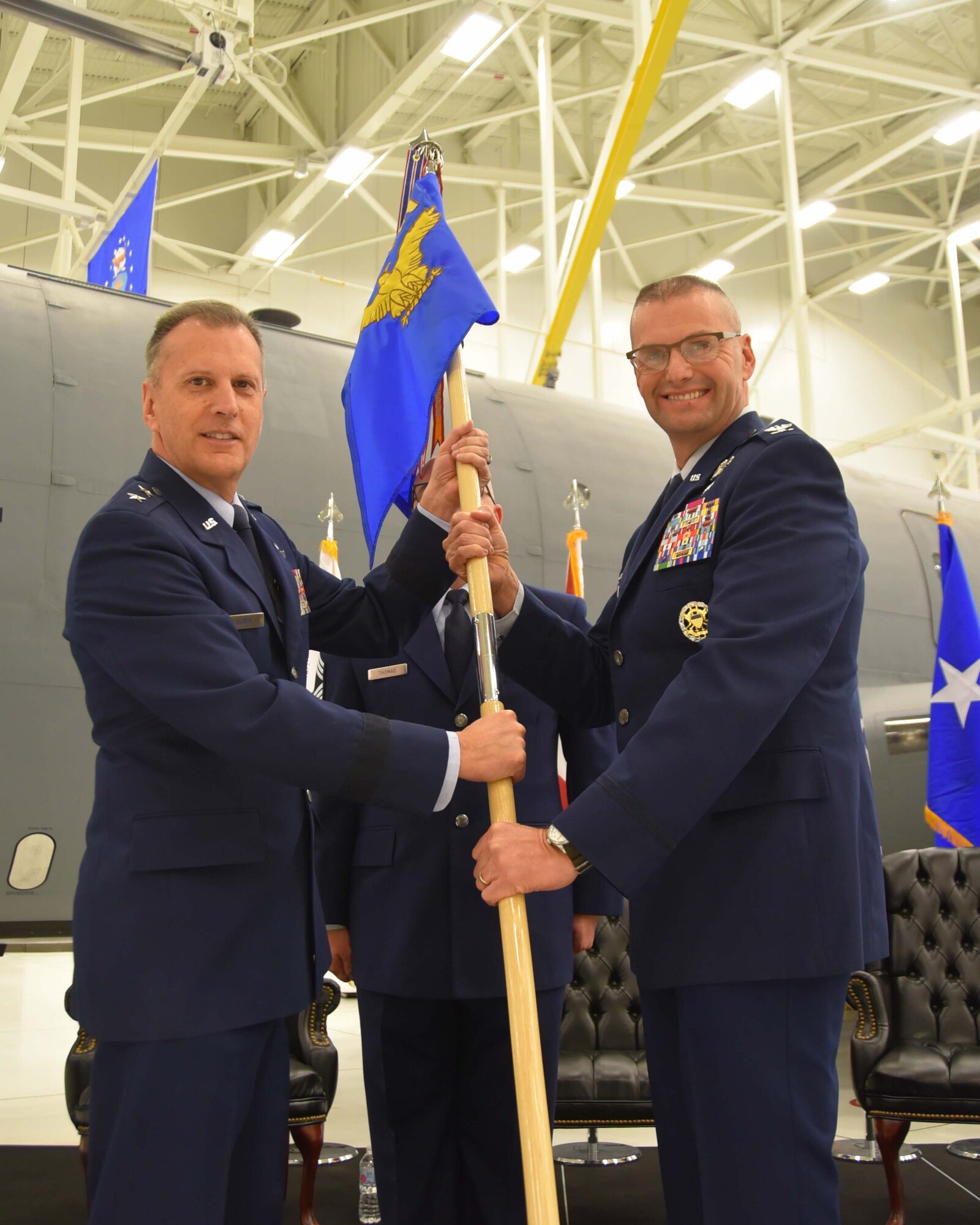 Maj. Gen. Randall A. Ogden, 4th Air Force commander, hands the guidon to Col. Phil Heseltine, incoming 931st Air Refueling Wing commander, during a change of command ceremony Dec. 1, 2018, McConnell Air Force Base, Kan.  Prior to joining the 931st, Heseltine was the vice commander of the 22nd Air Refueling Wing, the active duty component at Team McConnell.  Heseltine is the first colonel to retire from the active duty to join the Air Force Reserve as a wing commander. (U.S. Air Force photo by Tech. Sgt. Abigail Klein)