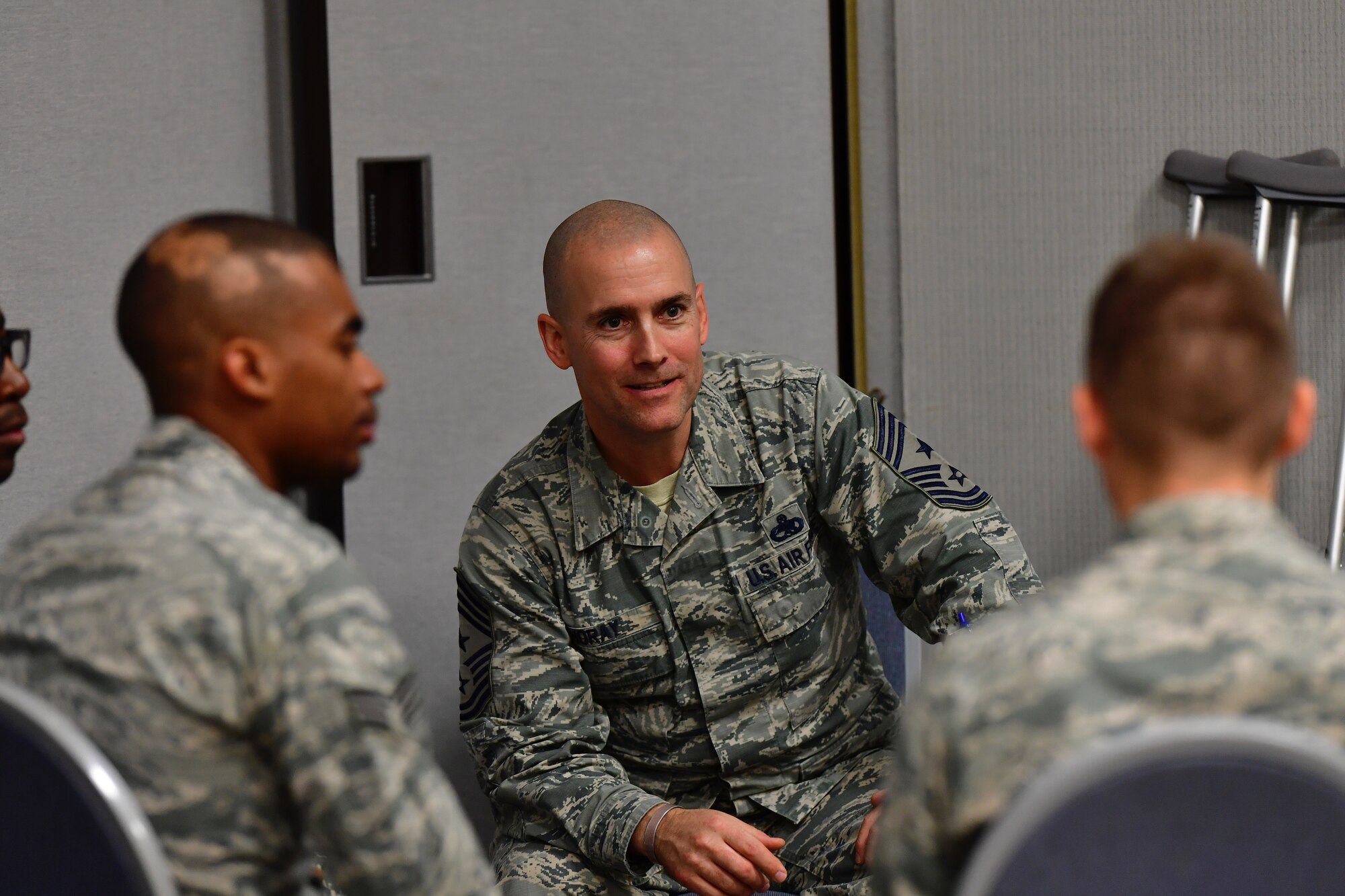 Senior Airman Jonathan Keith, 166th Logistics Readiness Squadron air transportation journeyman, listens to a senior leader at the first Delaware Air National Guard Speed Mentoring Event, Dec. 1, 2018 at New Castle Air National Guard Base, Delaware. During this event, Airmen were granted opportunities to partake in two-way communication with senior leaders about various topics. (U.S. Air National Guard photo by Staff Sgt. John Michaels)