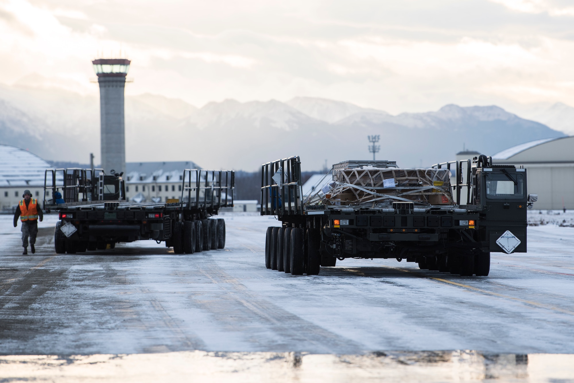 A k-loader containing cargo waits prior to offloading onto a C-17 Globemaster III at Joint Base Elmendorf-Richardson, Alaska, Dec. 1, 2018. JBER mission operations continue following a 7.0 earthquake hit to Anchorage, Alaska, on Nov. 30.
