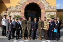 Leadership from Camp Foster, Marine Corps Air Station Futenma and the Ginowan City Mayor and his staff pose for a photo Nov. 29 at Terra Restaurant aboard Camp Foster, Okinawa, Japan.