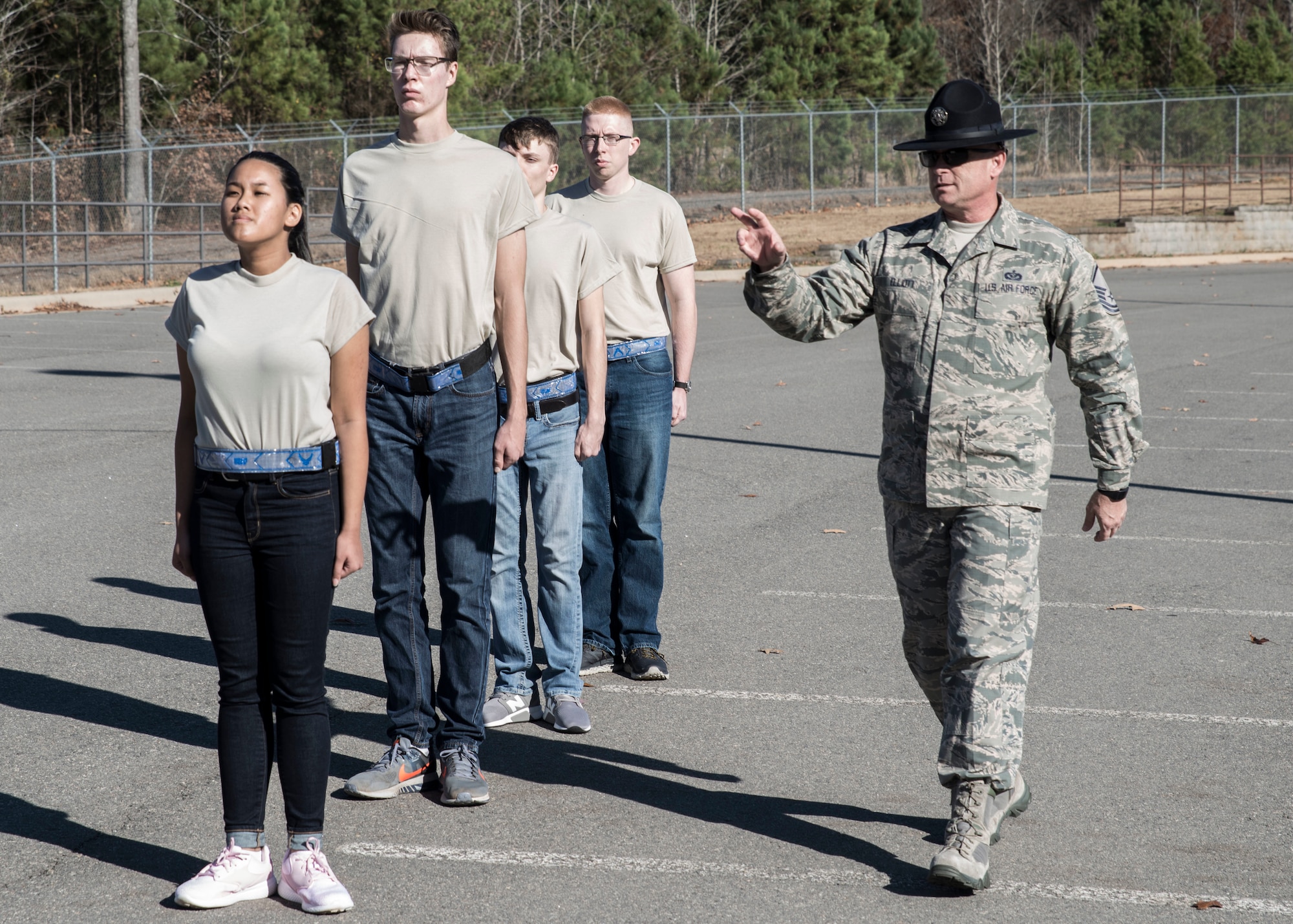 Master Sgt. Robert Elliot, 433rd Training Squadron Military Training Instructors and recruiter, trains new Air Force recruits on the proper techniques for facing movements at Little Rock Air Force Base, AR, Dec. 1, 2018.