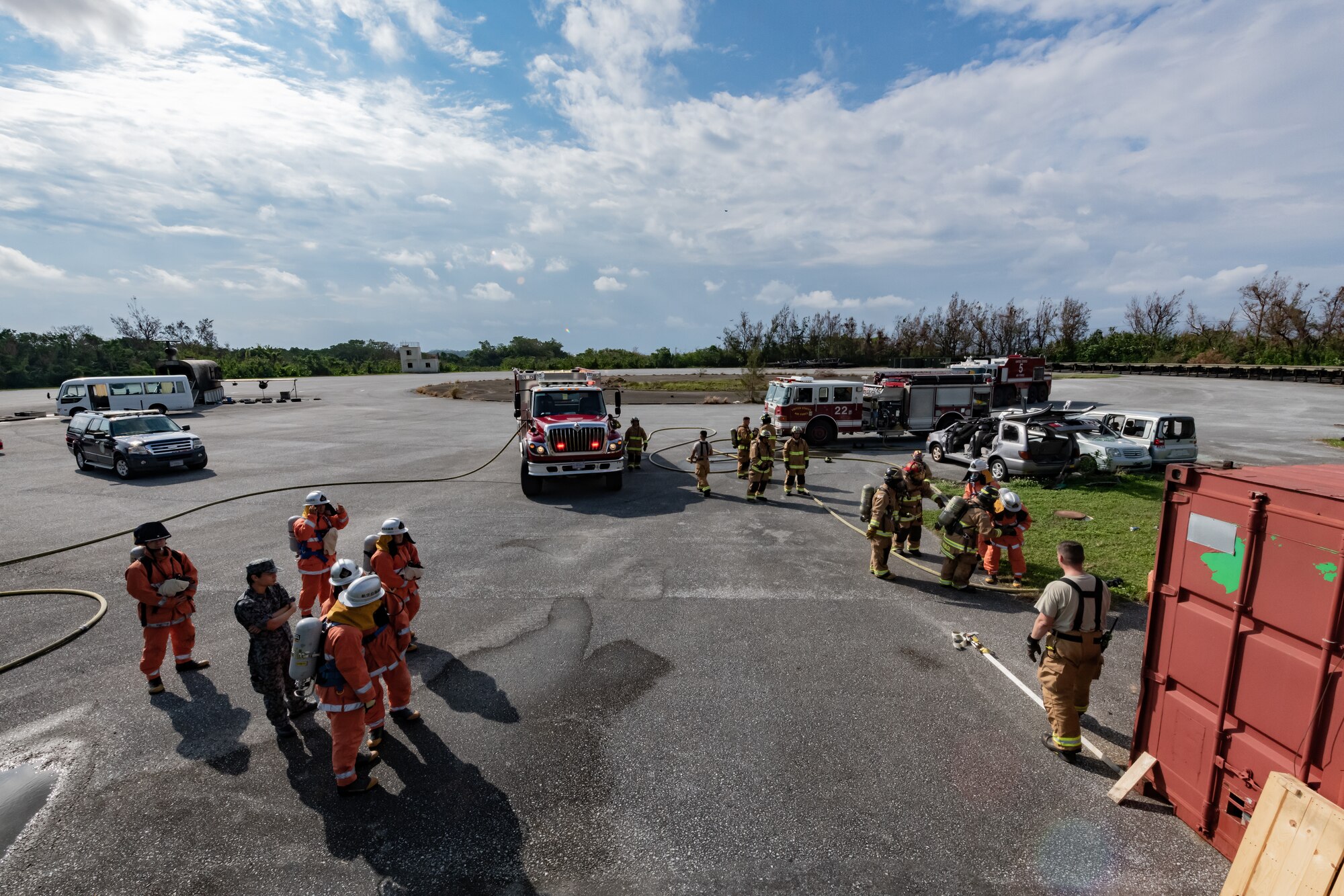 U.S. Air Force firefighters from the 18th Civil Engineer Squadron and Japan Air Self Defense Force firefighters from the 9th Wing, Naha Air Base, Japan, conduct structural live fire training Nov. 15, 2018, at Kadena Air Base, Japan. Firefighters conduct training regularly to maintain constant readiness for emergencies. (U.S. Air Force photo by Staff Sgt. Micaiah Anthony)