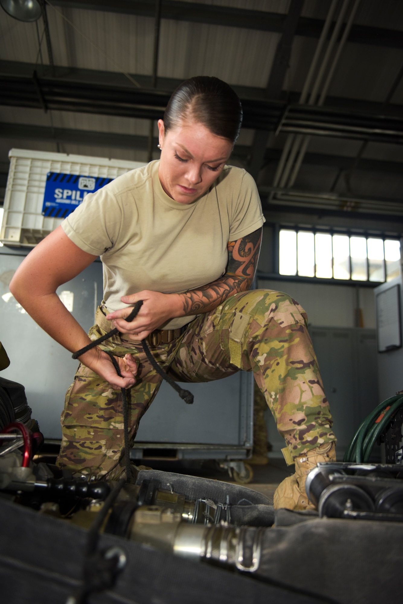 U.S. Air Force Senior Airman Tori Watts, 100th Logistics Readiness Squadron fuels distribution driver and 67th Special Operations Squadron Forward Arming and Refueling Point team member, packs a fuel hose for a FARP mission at RAF Mildenhall, England, Oct. 11, 2018. FARP is a specialty within the fuels career field where members selected to the team are certified to establish refueling sites and refuel airframes in austere locations. (U.S. Air Force photo by Airman 1st Class Alexandria Lee)