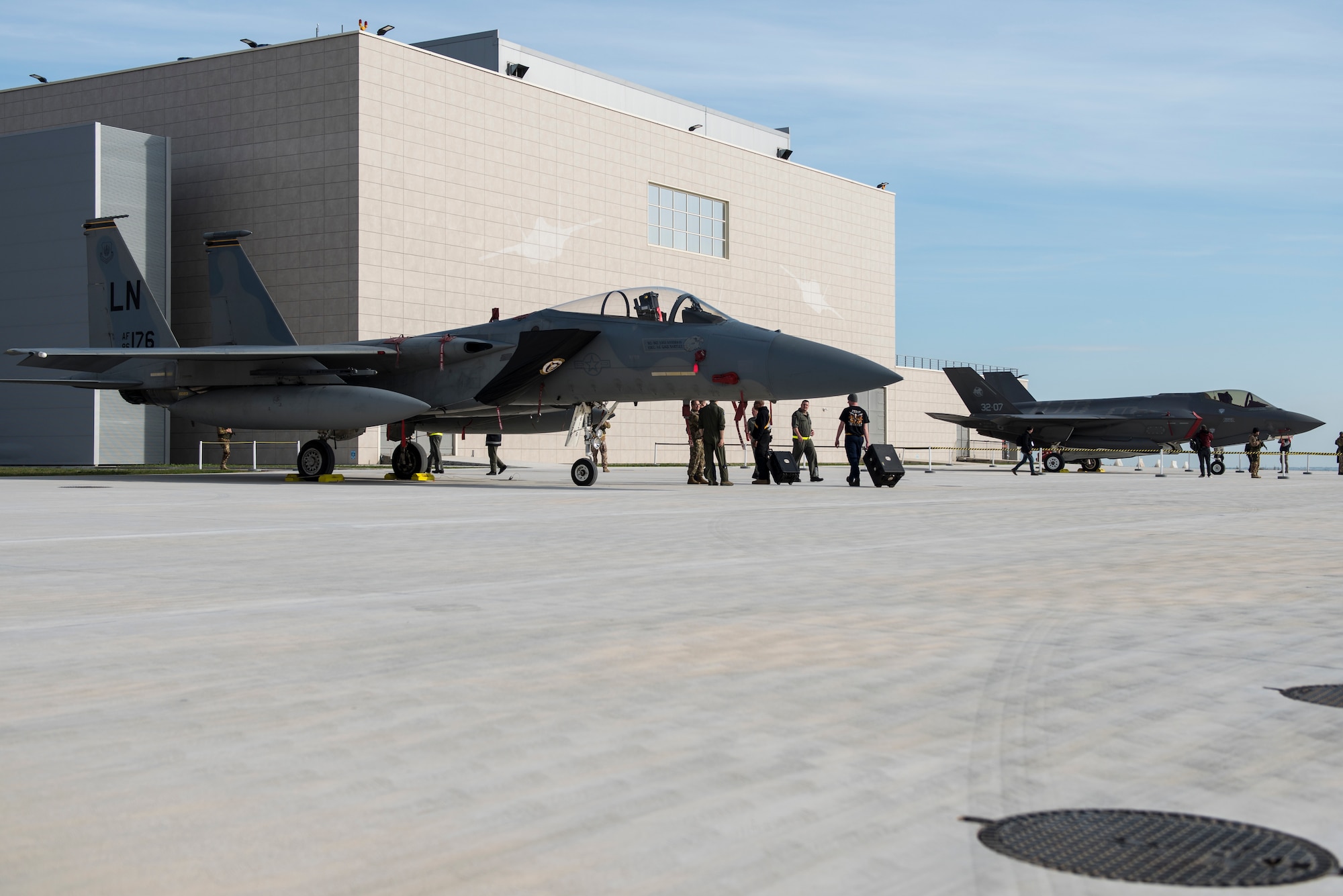 An F-15C Eagle assigned to the 493rd Fighter Squadron, and an Italian F-35A Lightning assigned to the 32nd Stormo, are put on display for a media event during the NATO Tactical Leadership Programme 18-4 at Amendola Air Base, Italy, Nov. 30, 2018. This event marks the first time the course has been held in Italy, from its normal host location at Albacete Air Base, Spain. (U.S. Air Force photo/ Senior Airman Malcolm Mayfield)