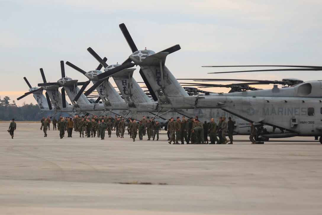 Marines and Sailors from Medium Tiltrotor Squadron 365, with the 24th Marine Expeditionary Unit, land at their homecoming reception for Exercise Trident Juncture 2018, at Marine Corps Air Station New River, N.C., Nov. 30, 2018. The squadron participated in the NATO exercise from USS Iwo Jima (LHD7) in Iceland and Norway. The Marines and Sailors were instrumental in providing vertical lift and transport capabilities in an amphibious environment while training in a challenging climate, enabling the MEU to offload combat capabilities and equipment. (U.S. Marine Corps photo by Lance Cpl. Tanner Seims)
