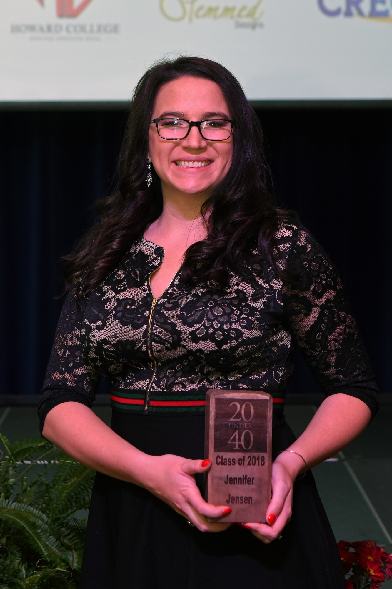 Jennifer Jensen, one of two Goodfellow spouses awarded, poses with her award after being recognized as one of San Angelo’s “20 under 40” at the C.J. Davidson Conference Center in San Angelo, Texas, Nov. 30, 2018. Jensen works at West Texas Counseling and Guidance using her experience as an Air Force veteran to be able to better help those in the community. (U.S. Air Force photo by Airman 1st Class Zachary Chapman/Released)