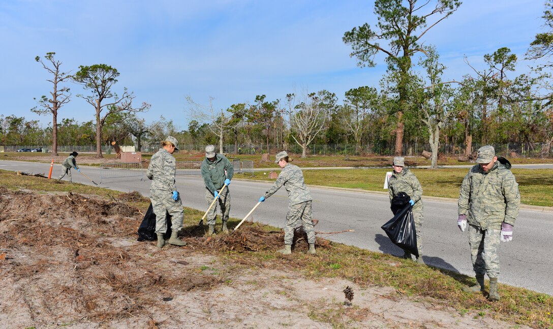 Task Force Talon II Airmen remove debris from the roadside at Tyndall Air Force Base, Fla., Nov. 29, 2018. Task Force Talon II is responsible for clearing debris and cleaning various parts of the base to include parts of the flightline and dormitories. (U.S. Air Force photo by Senior Airman Cody R. Miller)