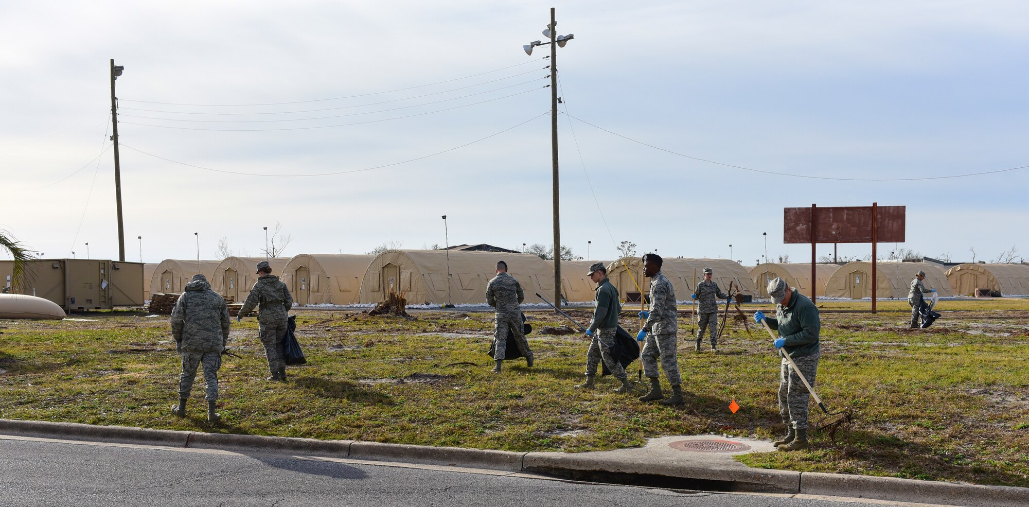 Task Force Talon II Airmen remove debris from the “tent city” at Tyndall Air Force Base, Fla., Nov. 29, 2018. Task Force Talon II is responsible for clearing debris and cleaning various parts of the base to include parts of the flightline and dormitories. (U.S. Air Force photo by Senior Airman Cody R. Miller)