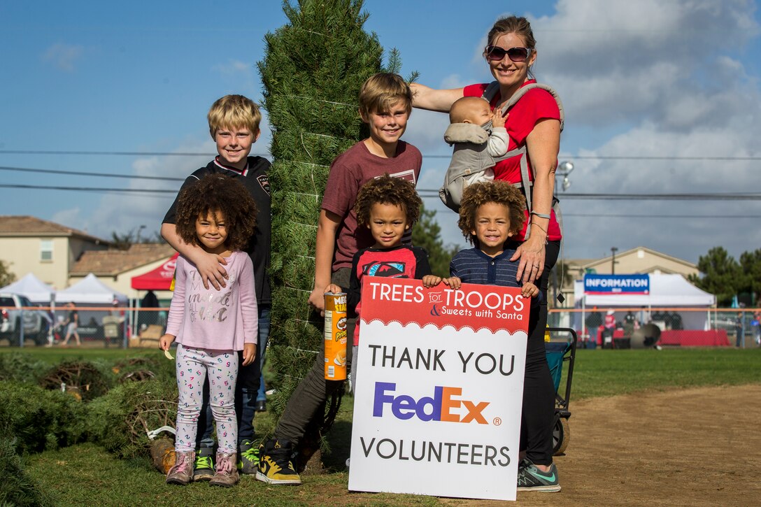 U.S. service members, Department of Defense employees and their families attend the Trees for Troops event at Marine Corps Base Camp Pendleton, California, Dec. 1, 2018. The event provided service members and their families an opportunity to celebrate the holiday season and the chance to take a Christmas tree home. (U.S. Marine Corps photo by Cpl. Dylan Chagnon)