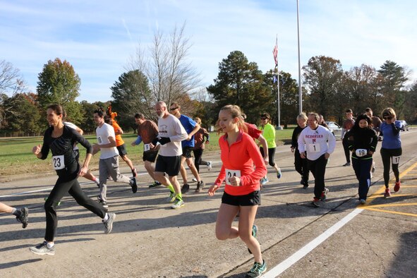 Runners taking part in the 33rd Annual AEDC Turkey Trot bolt from the starting line. The 5K, which was held on Nov. 16, began in front of the Administration & Engineering Building at Arnold Air Force Base, took runners around Kindel Drive, onto the base Fitness Trail and back around Kindel Drive to finish back at the A&E Building. (U.S. Air Force photo by Brad Hicks)