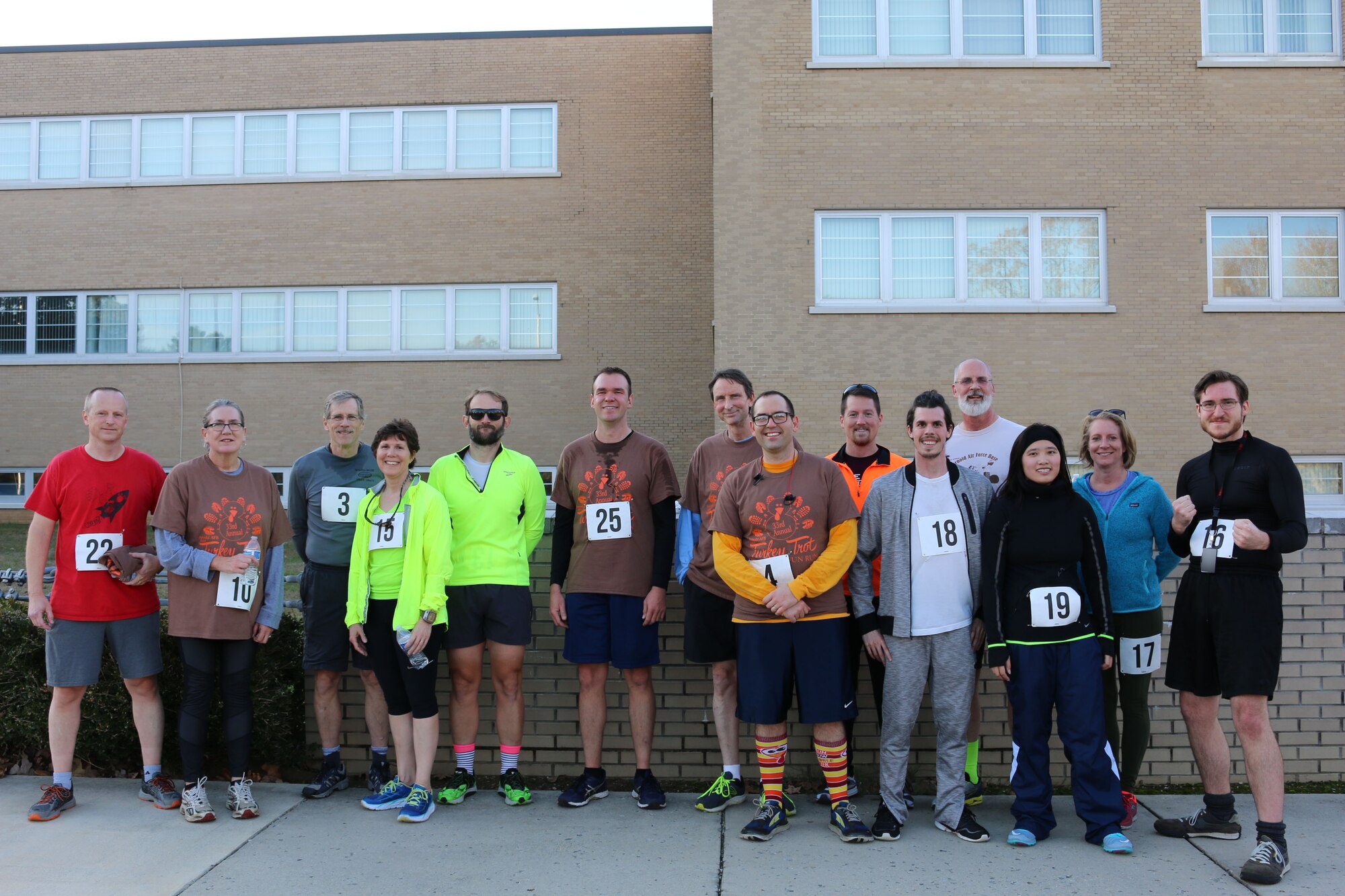 Some of the participants in the 33rd Annual AEDC Turkey Trot, which took place on Nov. 16 at Arnold Air Force Base, pose for a photo following the race. This year’s Turkey Trot drew more than two dozen runners. (U.S. Air Force photo by Brad Hicks) (This image was altered by obscuring badges for security purposes)