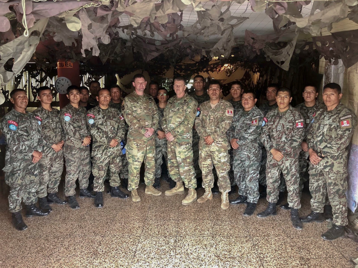 West Virginia Army National Guard (WVARNG) Master Sgt. Ricky Baker and Sgt. 1st Class Joshua Dunlap pose for a photo with members of the Peruvian Army following the completion of a Subject Matter Expert Exchange (SMEE) Global Peace Operations Initiative (GPOI) mission held in Lima, Peru, Nov. 26 – 30, 2018. The SMEE GPOI mission with the Peruvian Army helped to improve maintenance support for Peru’s Training Center for Peace Operations upcoming mission to the Central African Republic and enhanced non-commissioned officer (NCO) development in their armed forces. (courtesy photo)