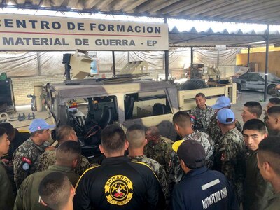 West Virginia Army National Guard (WVARNG) Master Sgt. Ricky Baker discusses preventative maintenance checks and services of the M1165 HMMWV Nov. 28, 2018, with Peruvian Army maintenance personnel during a Subject Matter Expert Exchange (SMEE) Global Peace Operations Initiative (GPOI) mission held in Lima, Peru. The WVARNG helped to improve maintenance support for Peru’s Training Center for Peace Operations upcoming mission to the Central African Republic and enhanced non-commissioned officer (NCO) development in their armed forces. (courtesy photo)