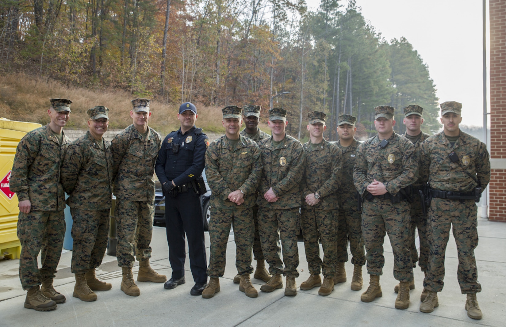 Nov 19: Manpower & Reserve Affairs Commanding General, LtGen Rocco and SgtMaj Black standing with Marines and civilian officers from Security Battalion. Both the Commanding General and SgtMaj were greeting personnel aboard the installation and passing out "Protect What You Have Earned" cards at the gates prior to the Thanksgiving weekend.