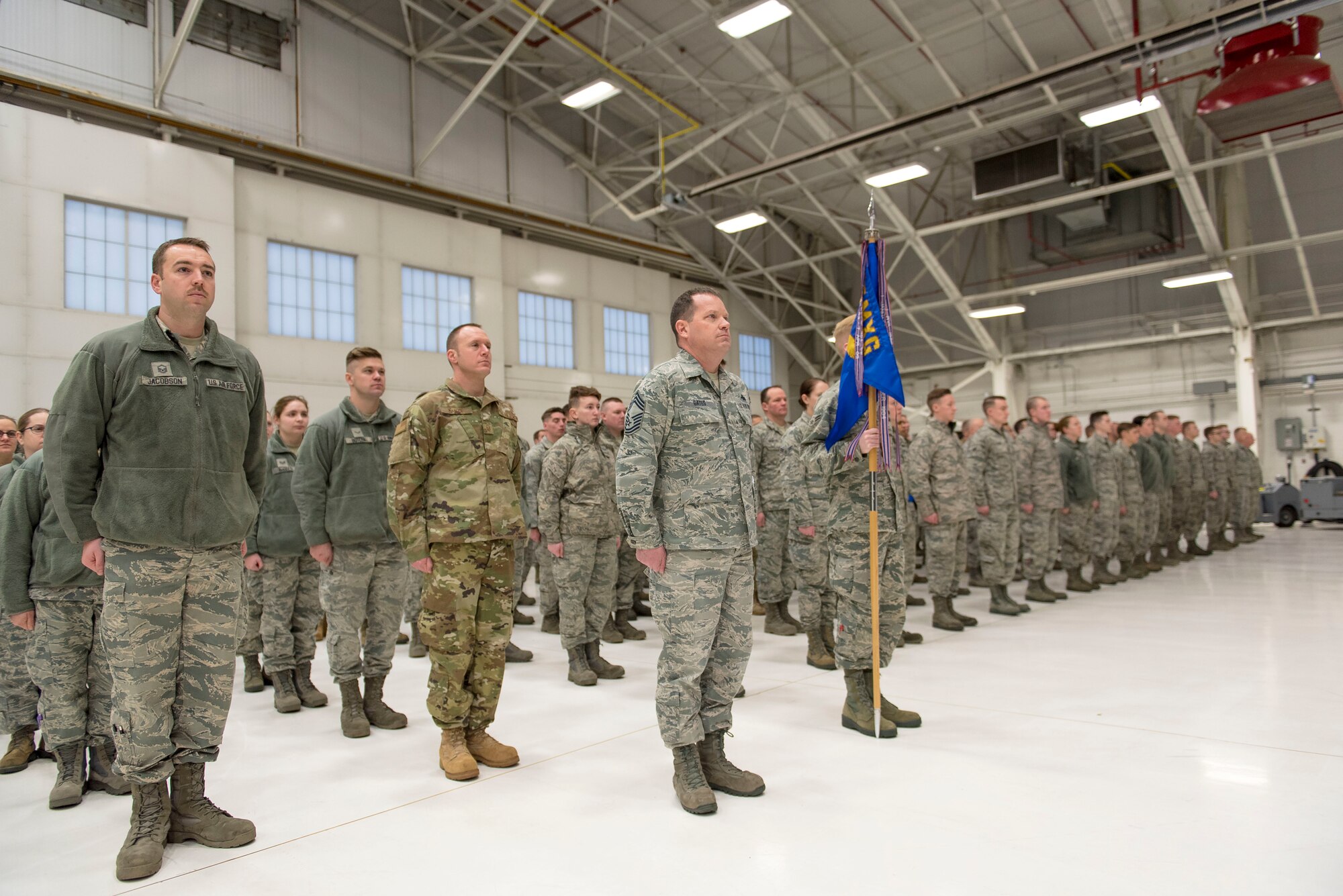 Airmen from the 115th Maintenance Group, Truax Field, Wisconsin, stand in formation during the 115th MXG change of command ceremony December 2, 2018, at the 115th Fighter Wing on Truax. Col. Christopher Green is reliquishing command of the 115th MXG to Lt. Col. Wilhelmina Panzer. (U.S. Air National Guard photo by Airman 1st Class Cameron Lewis)
