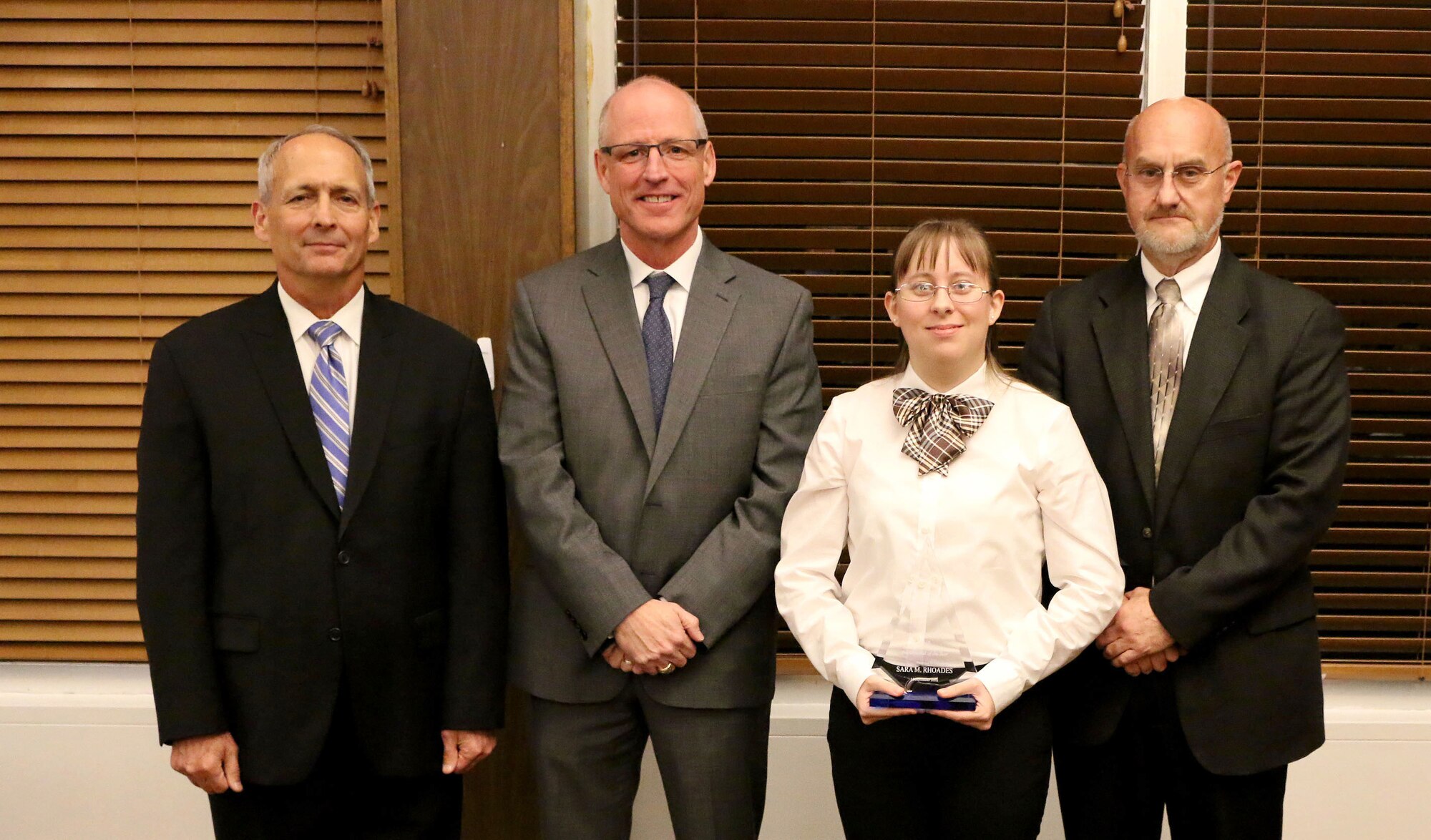 Facility Engineer/Scientist II Sara Rhoades (third from left) receives the Science and Technology Professional of the Year Award during the National Aerospace Solutions, LLC Salute to Excellence Annual Award Ceremony Nov. 14, 2018, at the Arnold Lakeside Center, Arnold Air Force Base, Tenn. Also pictured from left is NAS Deputy General Manager Michael Belzil, NAS General Manager Richard Tighe and NAS Technology Innovation Branch Manager Mark Brandon. (U.S. Air Force photo by Bradley Hicks)