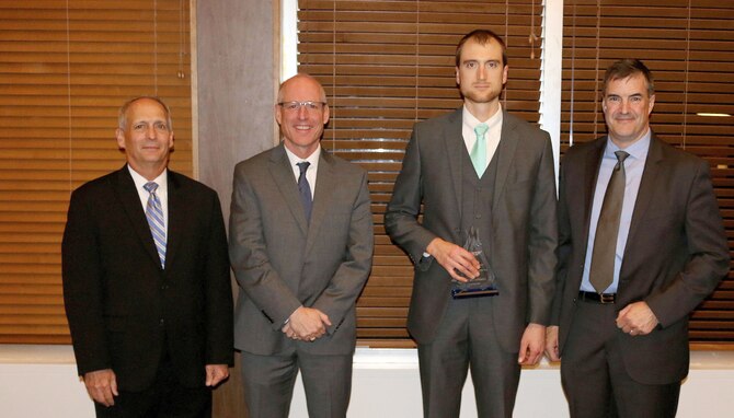 Mechanical Design Engineer Troy Wetherholt (third from left) receives the Engineer Analysis of the Year Award during the National Aerospace Solutions, LLC Salute to Excellence Annual Award Ceremony Nov. 14, 2018, at the Arnold Lakeside Center, Arnold Air Force Base, Tenn. Also pictured from left is NAS Deputy General Manager Michael Belzil, NAS General Manager Richard Tighe and NAS Mission Execution Director Roderick Cregier. (U.S. Air Force photo by Bradley Hicks)