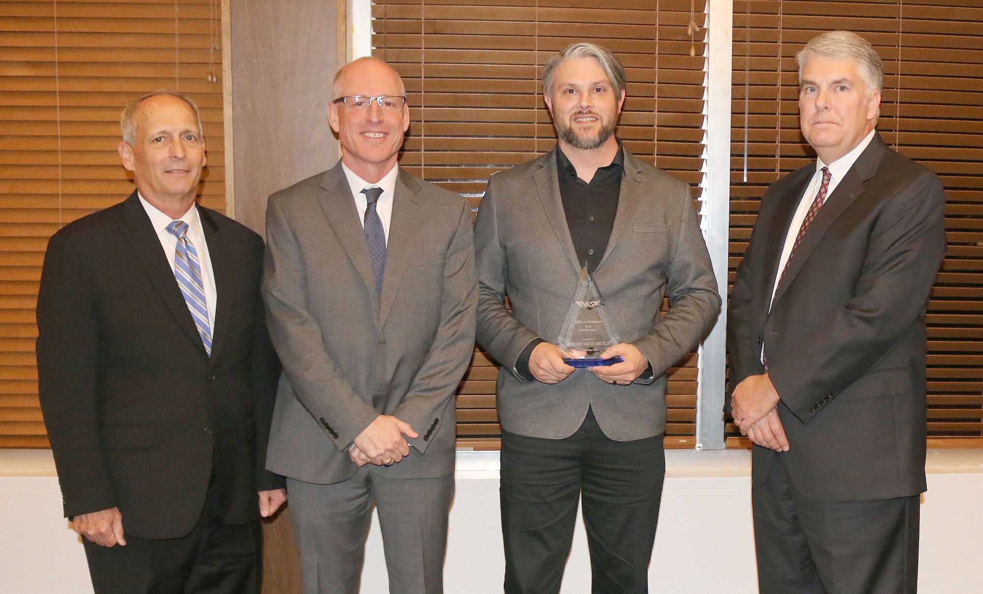 Acting Work Control Supervisor Edward D. Mickle (third from left) receives the Quality Award during the National Aerospace Solutions, LLC Salute to Excellence Annual Award Ceremony Nov. 14, 2018, at the Arnold Lakeside Center, Arnold Air Force Base, Tenn. Also pictured from left is NAS Deputy General Manager Michael Belzil, NAS General Manager Richard Tighe and NAS Test and Sustainment Engineering Manager Jeff Henderson. (U.S. Air Force photos by Bradley Hicks)
