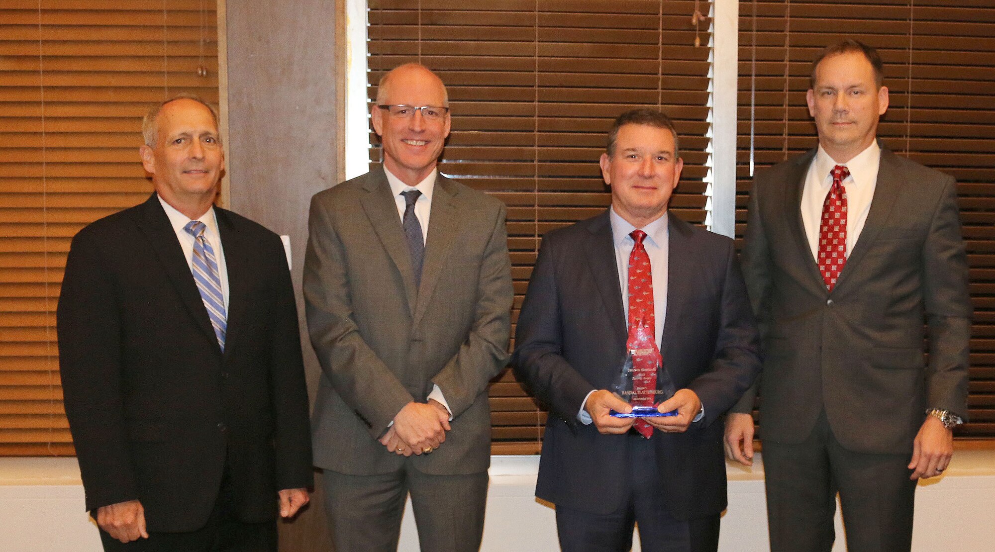 Propulsion Wind Tunnel Test Cell Supervisor Randal Plattenburg (third from left) receives the Security Award during the National Aerospace Solutions, LLC Salute to Excellence Annual Award Ceremony Nov. 14, 2018, at the Arnold Lakeside Center, Arnold Air Force Base, Tenn. Also pictured from left is NAS Deputy General Manager Michael Belzil, NAS General Manager Richard Tighe and NAS Business Services Director Chris Baker. (U.S. Air Force photo by Bradley Hicks)