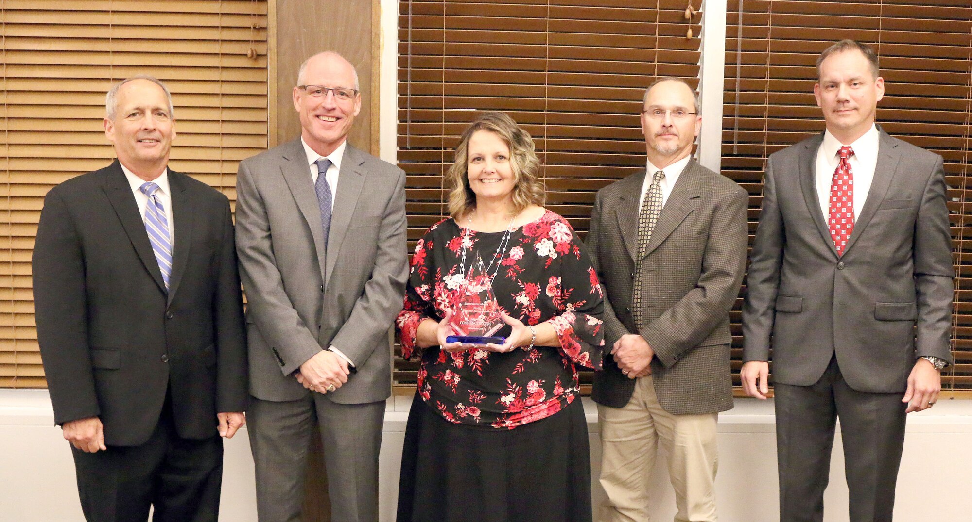 Technical Specialist Constance Rogers (third from left) receives the Customer Service Excellence Award during the National Aerospace Solutions, LLC Salute to Excellence Annual Award Ceremony Nov. 14, 2018, at the Arnold Lakeside Center, Arnold Air Force Base, Tenn. Also pictured from left is NAS Deputy General Manager Michael Belzil, NAS General Manager Richard Tighe, Chugach Base Operations - Utilities Manager Michael Harvey and NAS Business Services Director Chris Baker. (U.S. Air Force photo by Bradley Hicks)