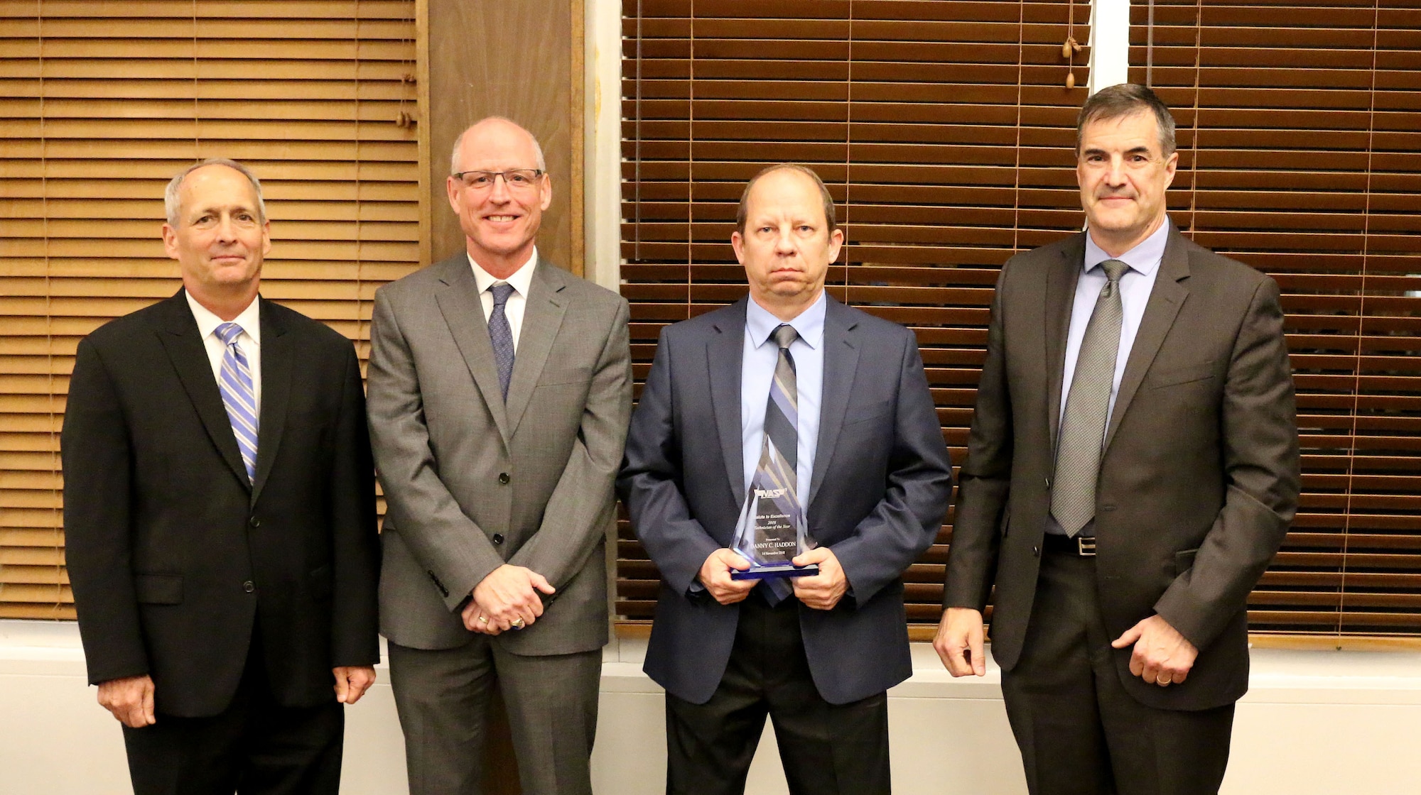 Outside Machinist Danny C. Haddon (third from left) receives the Technician of the Year Award during the National Aerospace Solutions, LLC Salute to Excellence Annual Award Ceremony Nov. 14, 2018, at the Arnold Lakeside Center, Arnold Air Force Base, Tenn. Also pictured from left is NAS Deputy General Manager Michael Belzil, NAS General Manager Richard Tighe and NAS Mission Execution Director Roderick Cregier. (U.S. Air Force photo by Bradley Hicks)