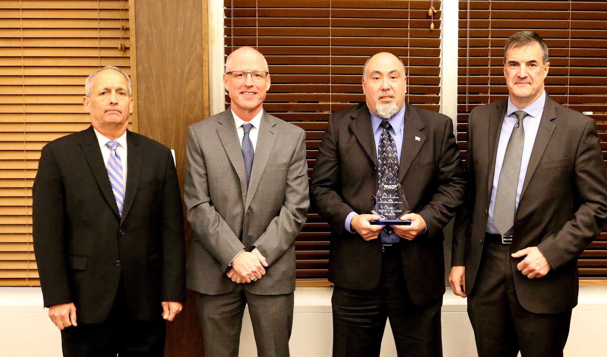 Precision Machining Supervisor Robert Williams (third from left) receives the Craft Supervisor/Superintendent of the Year Award during the National Aerospace Solutions, LLC Salute to Excellence Annual Award Ceremony Nov. 14, 2018, at the Arnold Lakeside Center, Arnold Air Force Base, Tenn. Also pictured from left is NAS Deputy General Manager Michael Belzil, NAS General Manager Richard Tighe and NAS Mission Execution Director Roderick Cregier. (U.S. Air Force photo by Bradley Hicks)