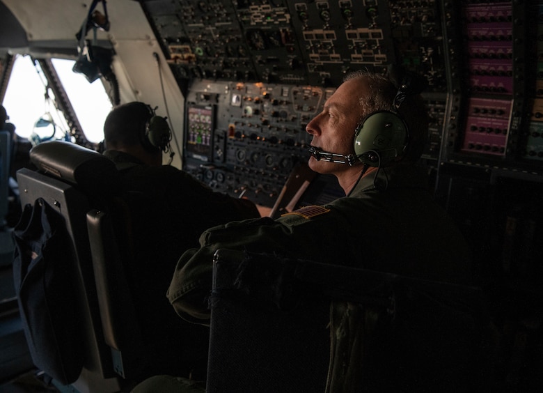 Chief Master Sgt. Larry C. Williams, Air Mobility Command command chief, looks out the flight deck windows while sitting in the instructor flight engineer seat during his final flight onboard a C-5M Super Galaxy Nov. 29, 2018, at Dover Air Force Base, Del. Williams was stationed at Dover AFB from Oct. 1989 to Aug. 2003 and then returned from July 2013 to June 2014 to serve as the superintendent for the 436th Operations Support Squadron and the 9th Airlift Squadron. (U.S. Air Force photo by Airman 1st Class Zoe M. Wockenfuss)