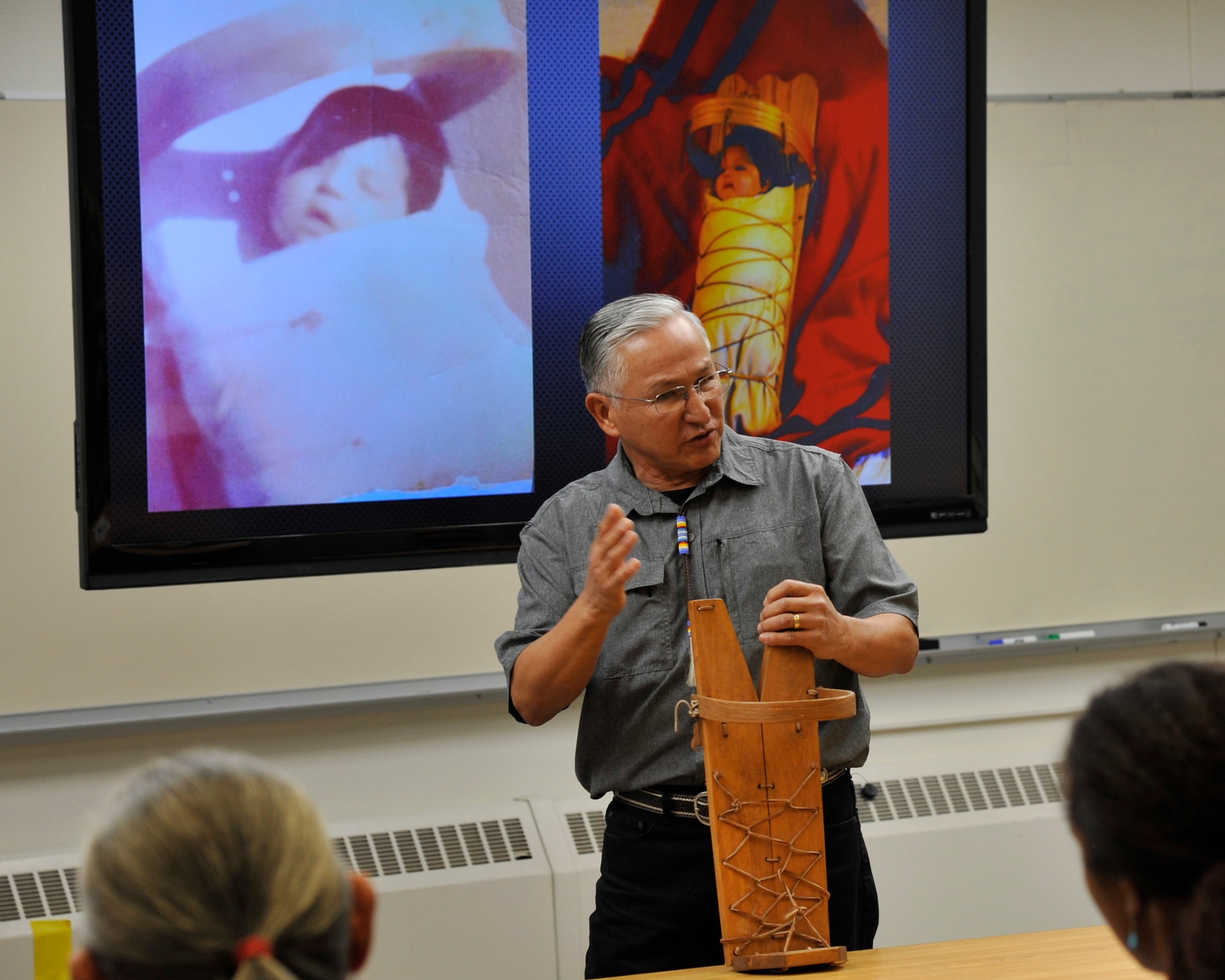 Dr. Casey Church makes a presentation on use of the cradleboard in Native American cultures during a Native American Heritage presentation at Sandia National Laboratory Nov. 30, 2018. (U.S. Air Force photo by Staff Sgt. Dylan Nuckolls)