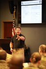 Stan Bacon, deputy director of JTF-CS plans, talks to leaders and representatives of the Defense CBRN Response Force (DCRF) for the Mission Planning Conference at Fort Eustis, Va., Dec. 3, 2018. The two-day conference includes key speakers, strategists and military panels building on a unified goal for the JTF-CS mission. When directed, JTF-CS is ready to respond in 24 hours to provide command and control of 5,200 federal military forces located at more than 36 locations throughout the nation in support of civil authority response operations to save lives, prevent further injury and provide critical support to enable community recovery. (DoD photo by Air Force Tech. Sgt. Michael Campbell/ Released)