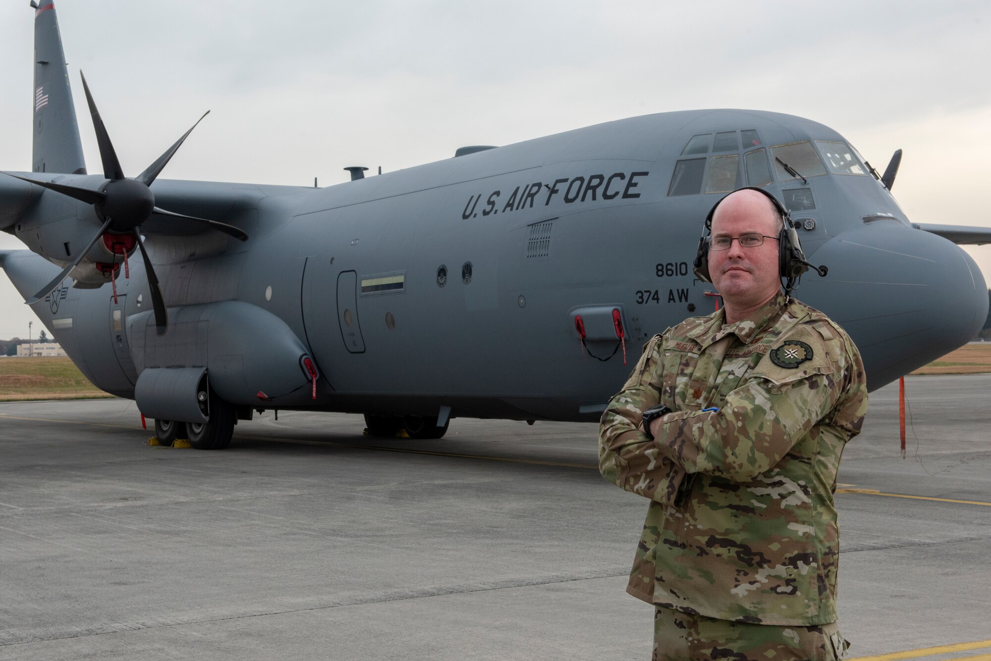 Maj. David L. Mueller, 374th Aircraft Maintenance Squadron commander, poses for a portrait in front of a C-130J Super Hercules at Yokota Air Base, Japan, Dec. 3, 2018.