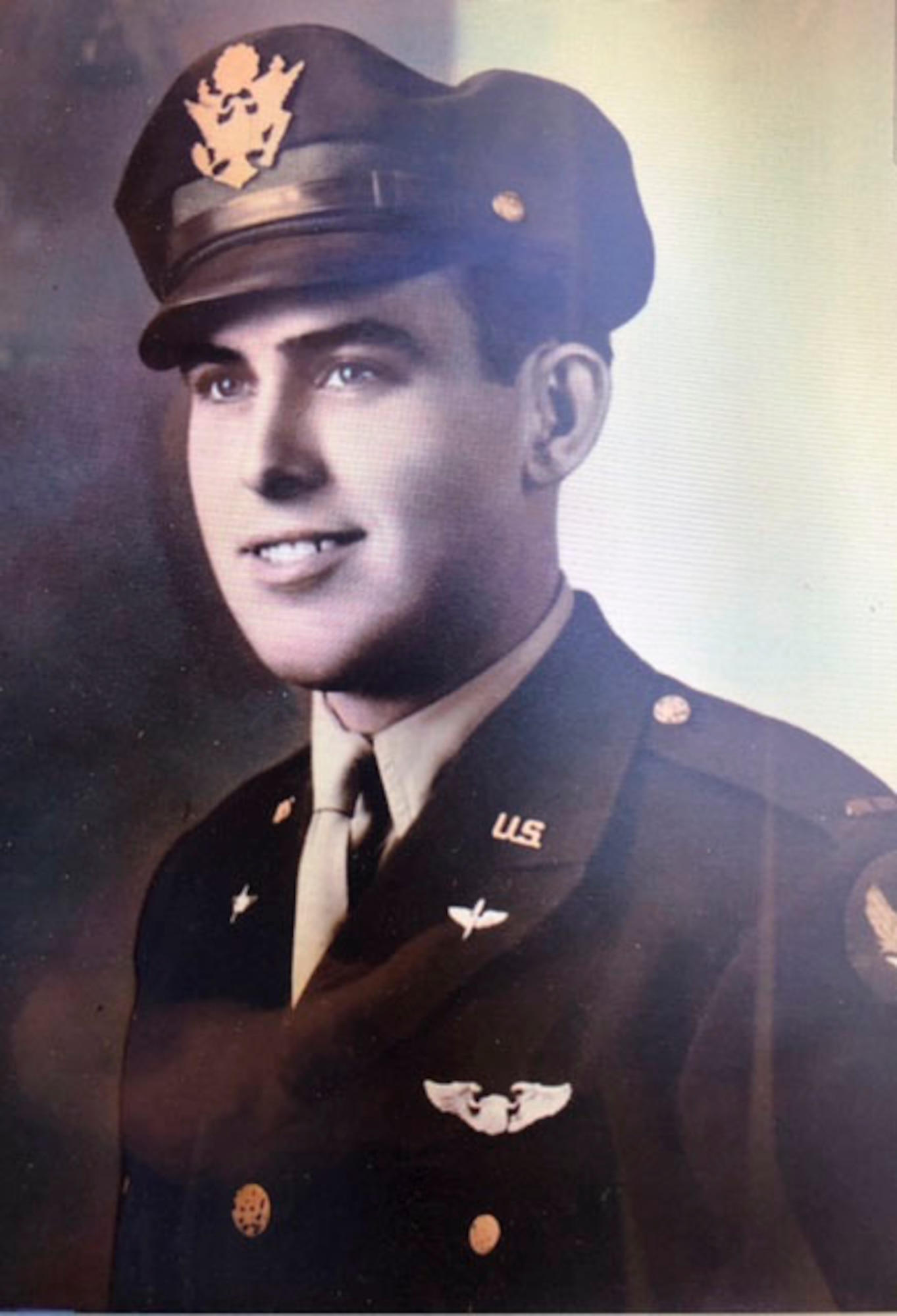 The late retired Col. Delbert L. Mueller poses for an official photo following his graduation from pilot training in 1944.