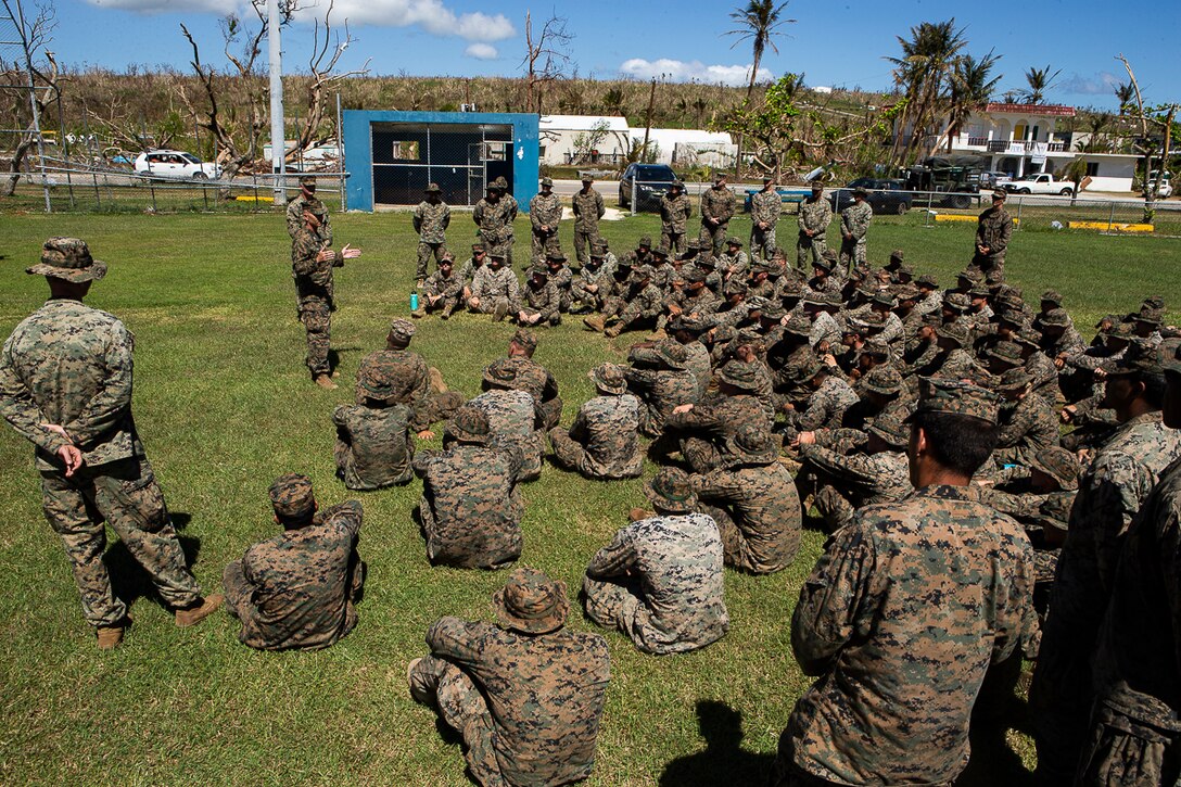 Col. Robert Brodie, commanding officer of the 31st Marine Expeditionary Unit, speaks with the Marines and Sailors of Combat Logistics Battalion 31 and the 31st MEU after a ceremony marking the end of the 31st MEU’s mission as part of the U.S. Defense Support of Civil Authorities relief efforts on Tinian, Commonwealth of the Northern Mariana Islands, Nov. 14, 2018. (U.S. Marine Corps photo by Gunnery Sgt. T. T. Parish/Released)